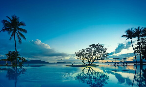 2 outdoor pools, open 7:00 AM to 10:00 PM, pool umbrellas, pool loungers