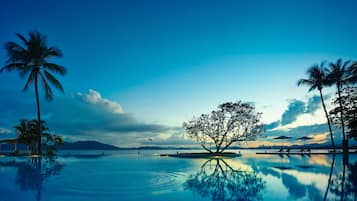 2 outdoor pools, open 7:00 AM to 10:00 PM, pool umbrellas, pool loungers