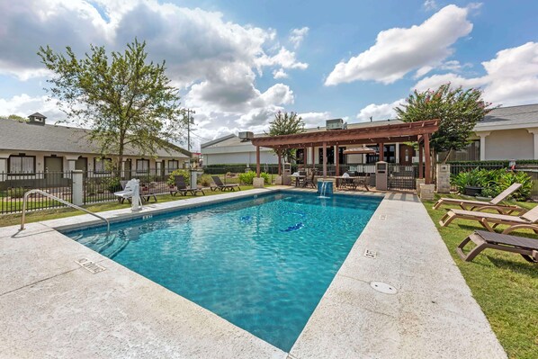 Seasonal outdoor pool, open 8:30 AM to 10:00 PM, pool umbrellas