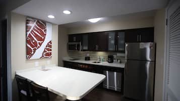 Studio Suite, 1 King Bed, Non Smoking | Private kitchen | Full-size fridge, microwave, stovetop, dishwasher