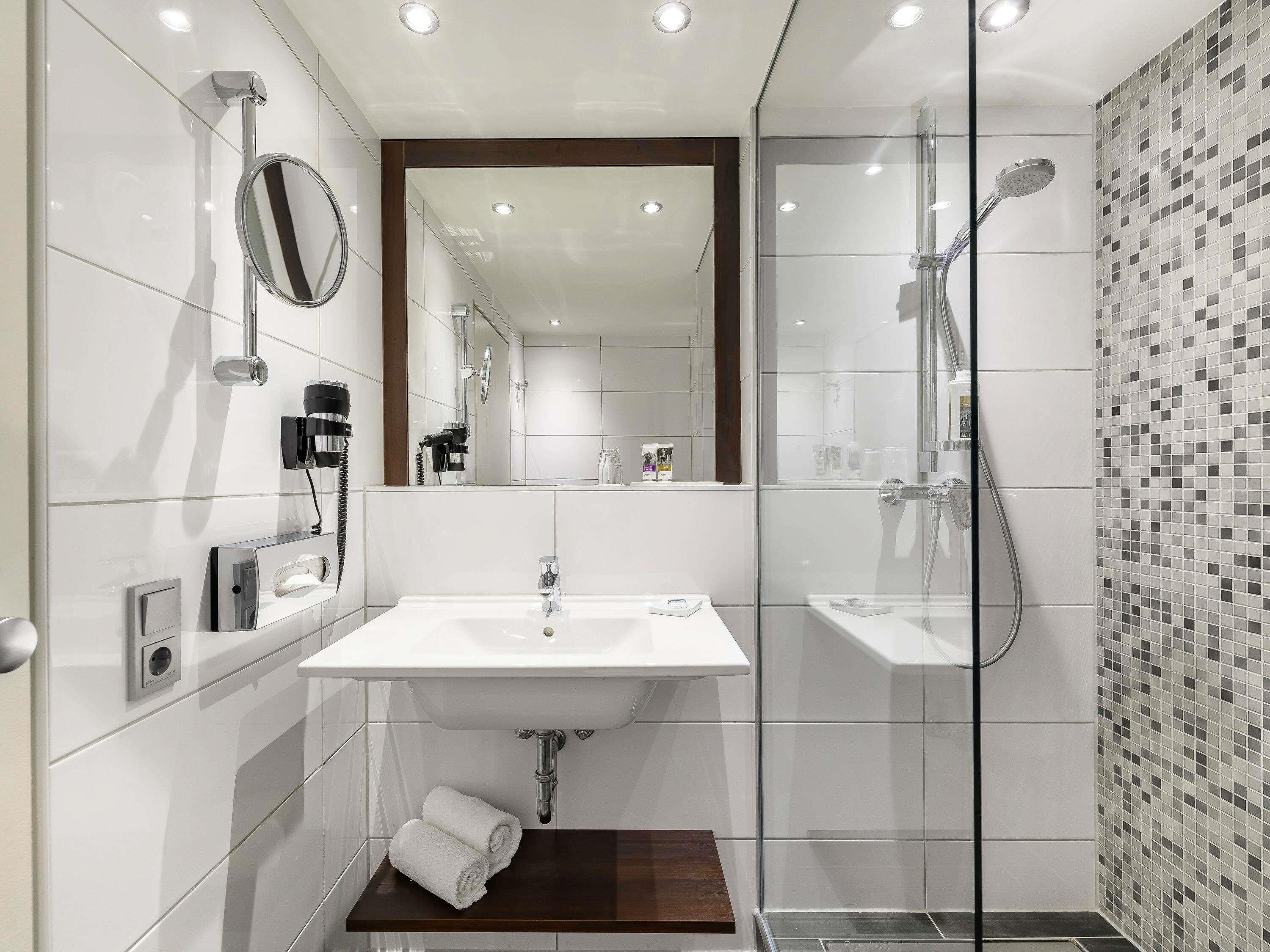 Shower, eco-friendly toiletries, hair dryer, towels