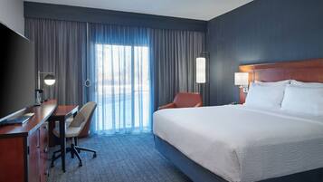 Desk, laptop workspace, iron/ironing board, free cribs/infant beds