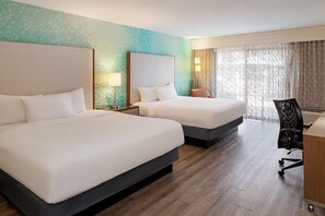 Premium bedding, pillow-top beds, desk, laptop workspace