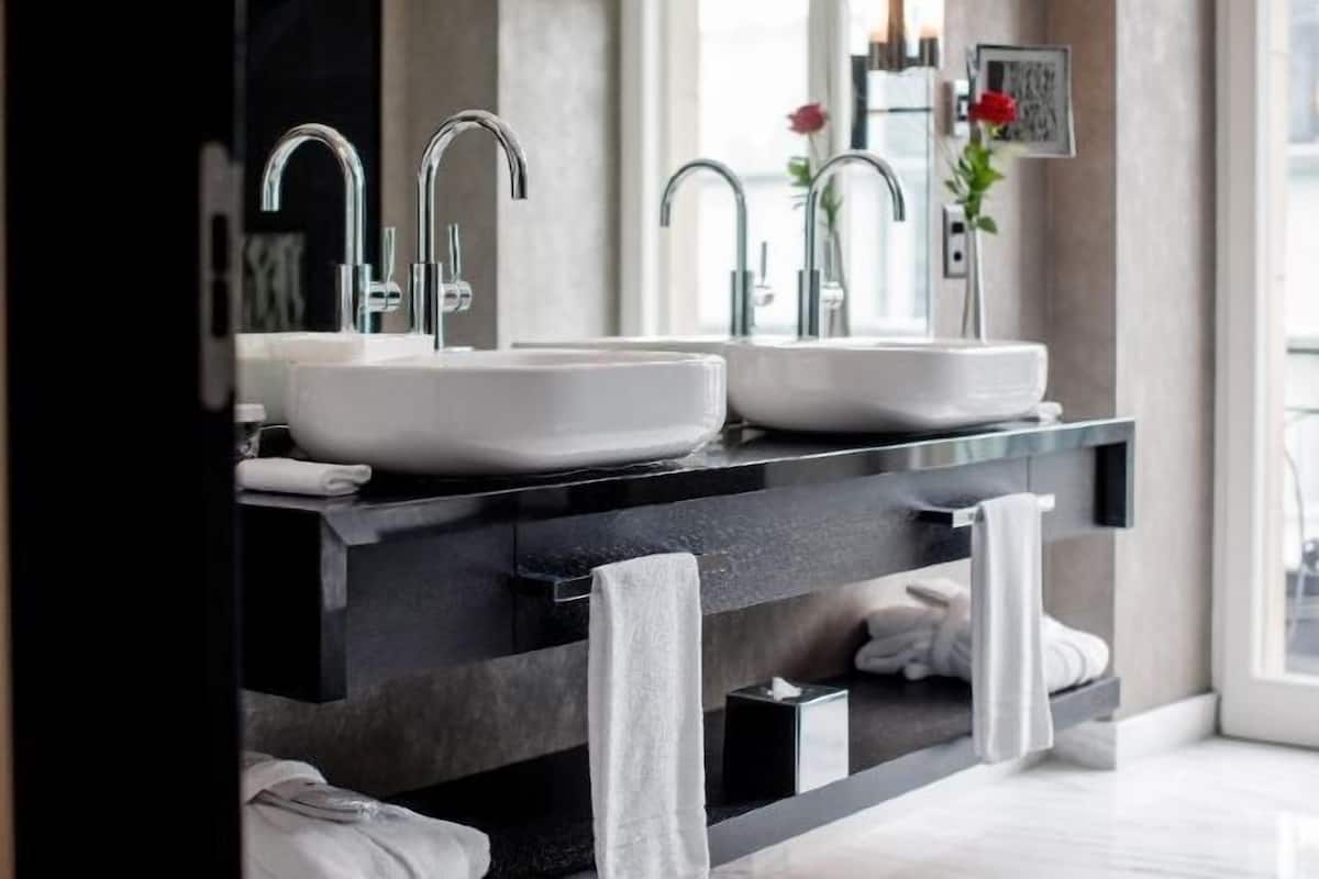 Bathroom | Rainfall showerhead, designer toiletries, hair dryer, bathrobes