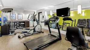 A gym with treadmills, an elliptical, and various exercise equipment. - Best Western Naperville Inn (Naperville)