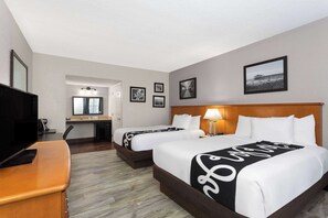 Premium bedding, pillow-top beds, desk, laptop workspace