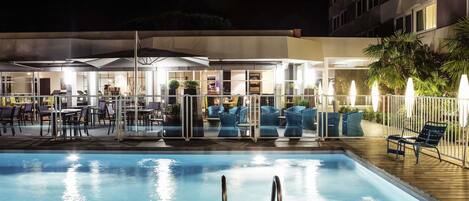 Seasonal outdoor pool, open 9:00 AM to 9:00 PM, pool umbrellas