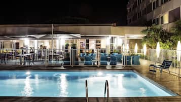 Seasonal outdoor pool, open 9:00 AM to 9:00 PM, pool umbrellas