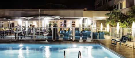 Seasonal outdoor pool, open 9:00 AM to 9:00 PM, pool umbrellas