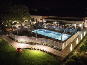 Seasonal outdoor pool, open 9:00 AM to 9:00 PM, pool umbrellas