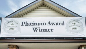 A banner on a building stating "Platinum Award Winner" from Choice Hotels 2015.