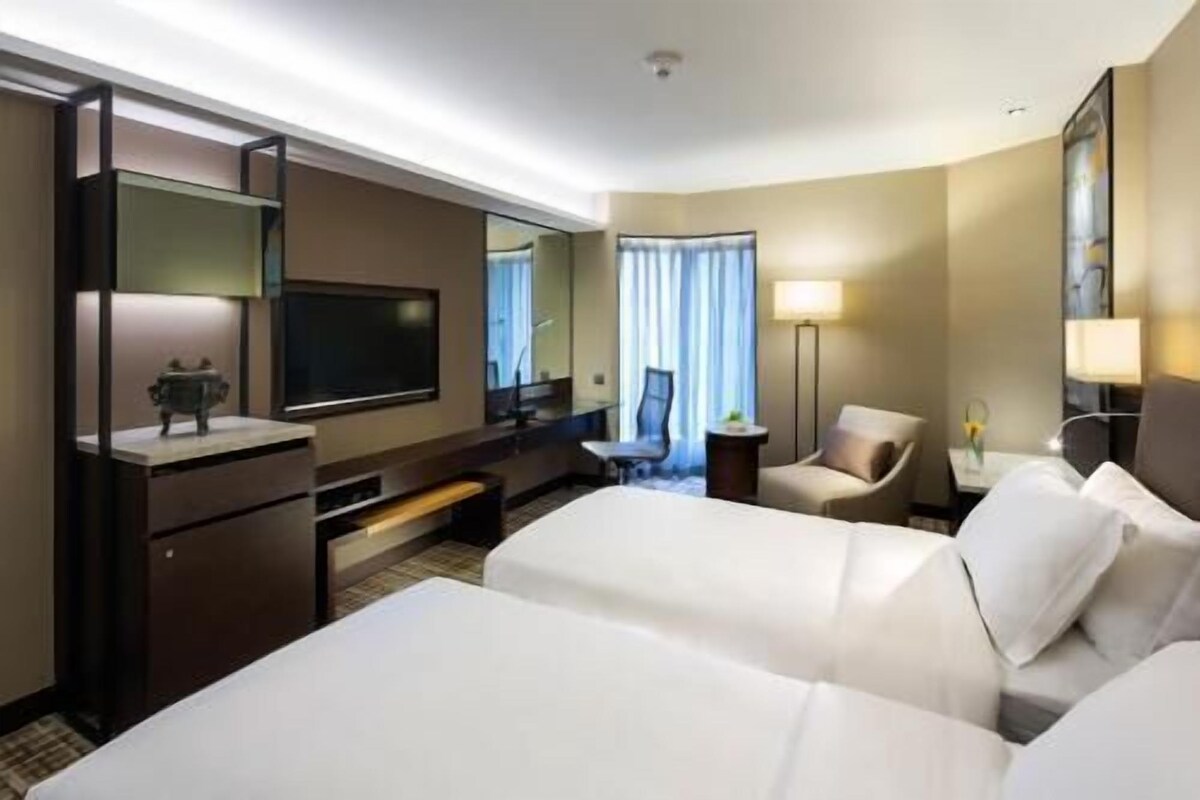 Luxe beddengoed, een minibar, een kluis op de kamer, een bureau