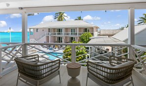 Room, 2 Queen Beds, Balcony, Partial Ocean View | In-room safe, soundproofing, iron/ironing board, bed sheets