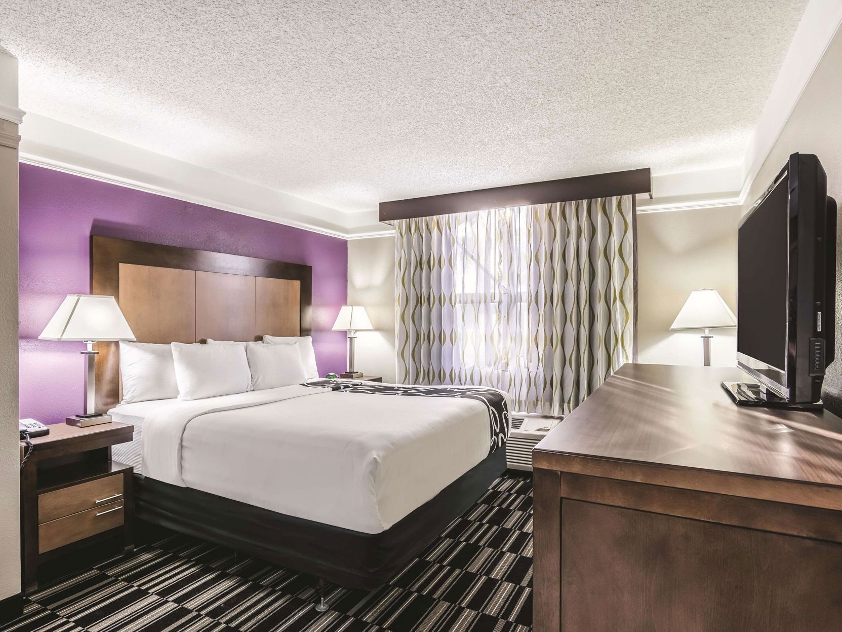 Premium bedding, pillow-top beds, blackout curtains, iron/ironing board