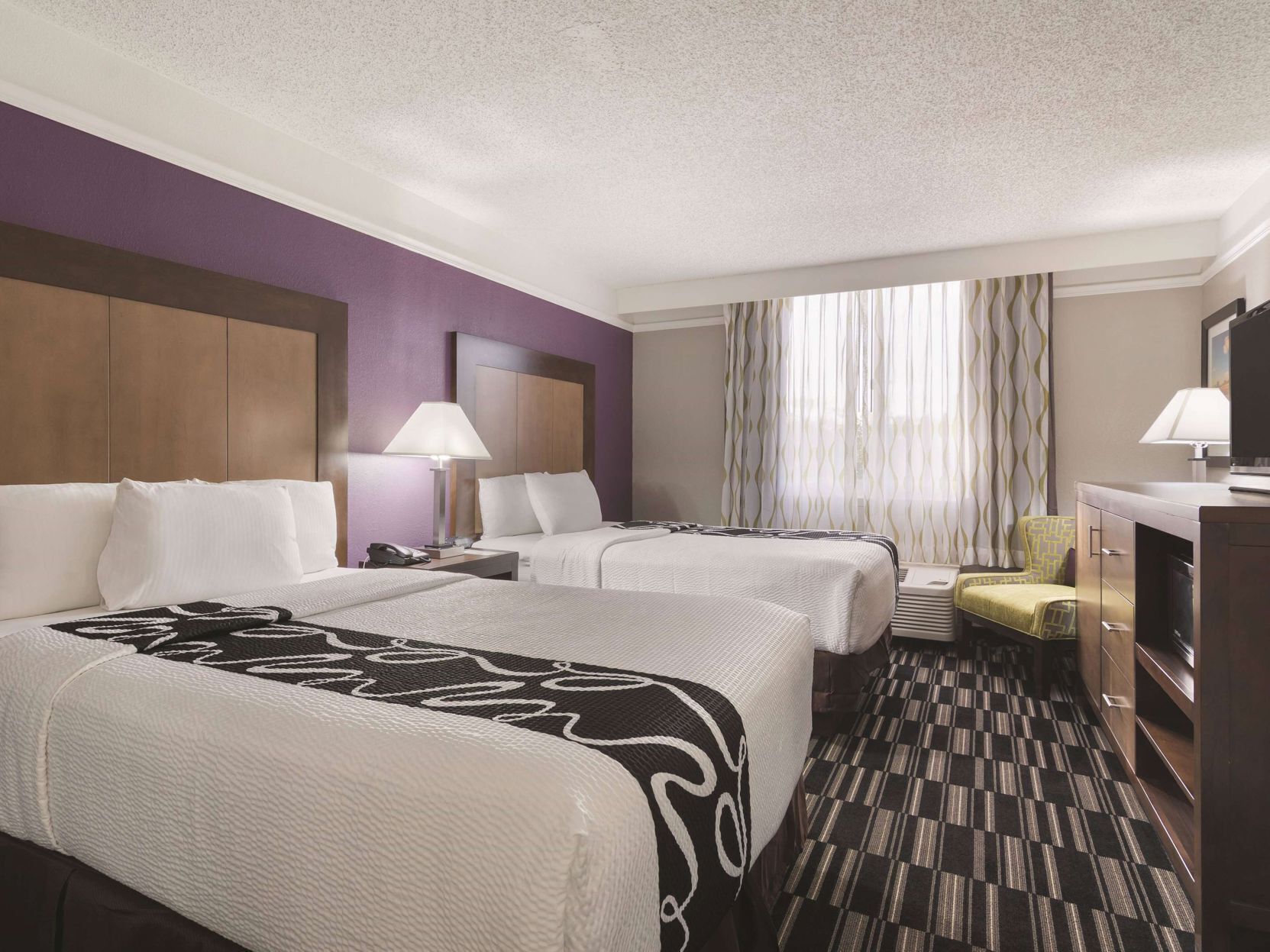 Premium bedding, pillow-top beds, blackout curtains, iron/ironing board