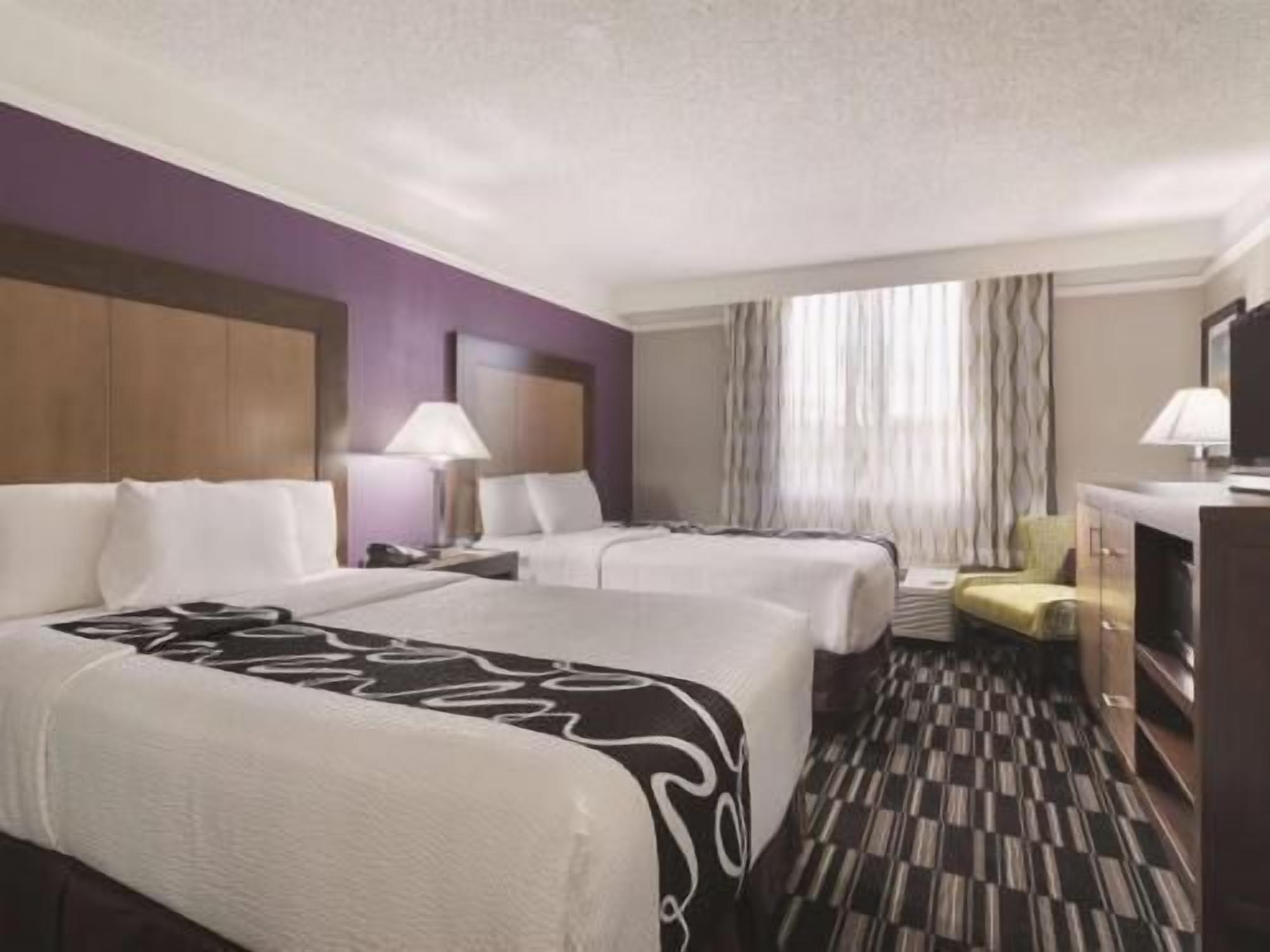 Premium bedding, pillow-top beds, blackout curtains, iron/ironing board