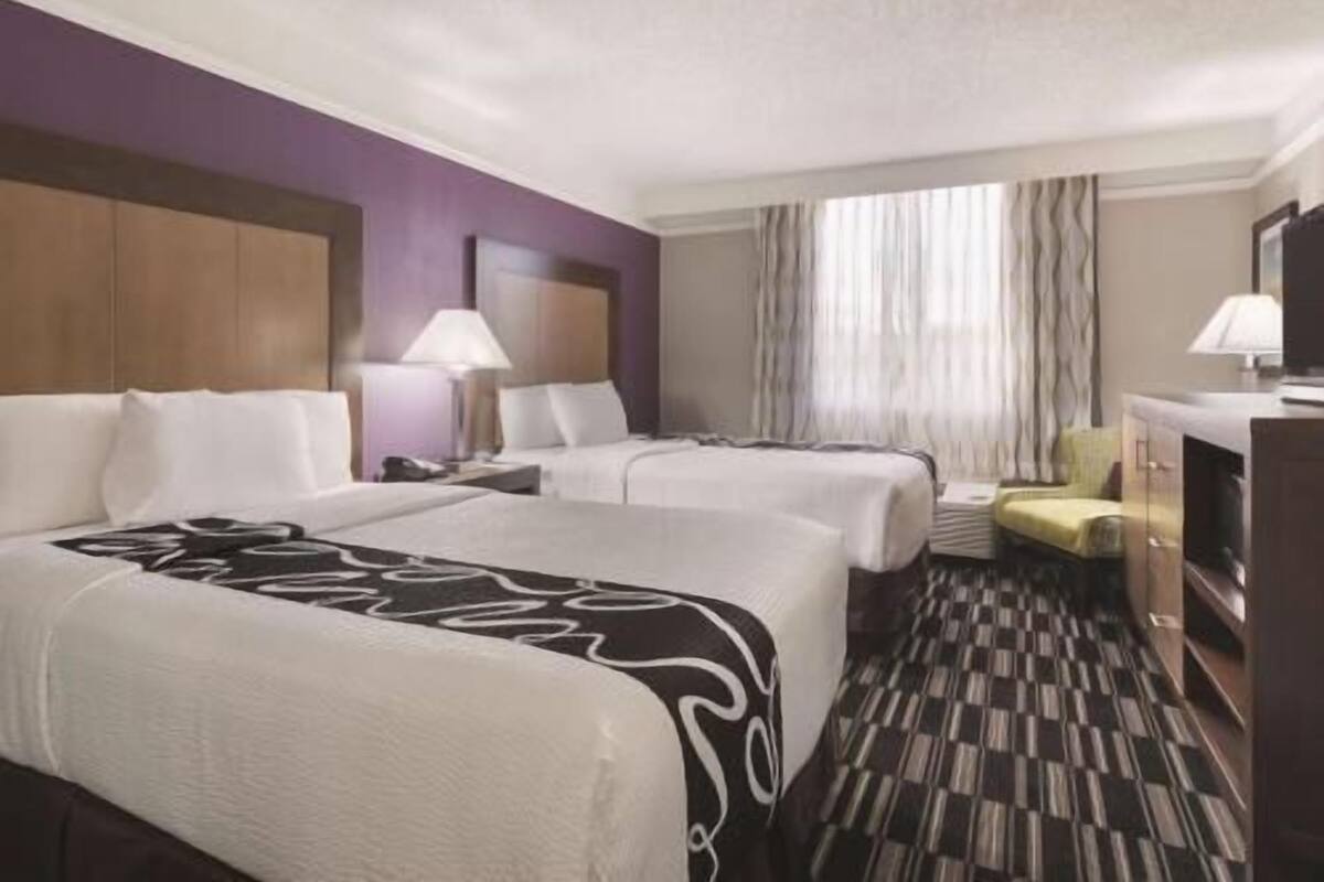 Premium bedding, pillow-top beds, blackout curtains, iron/ironing board