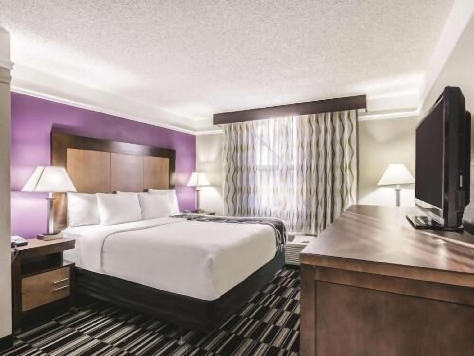 Premium bedding, pillow-top beds, blackout curtains, iron/ironing board