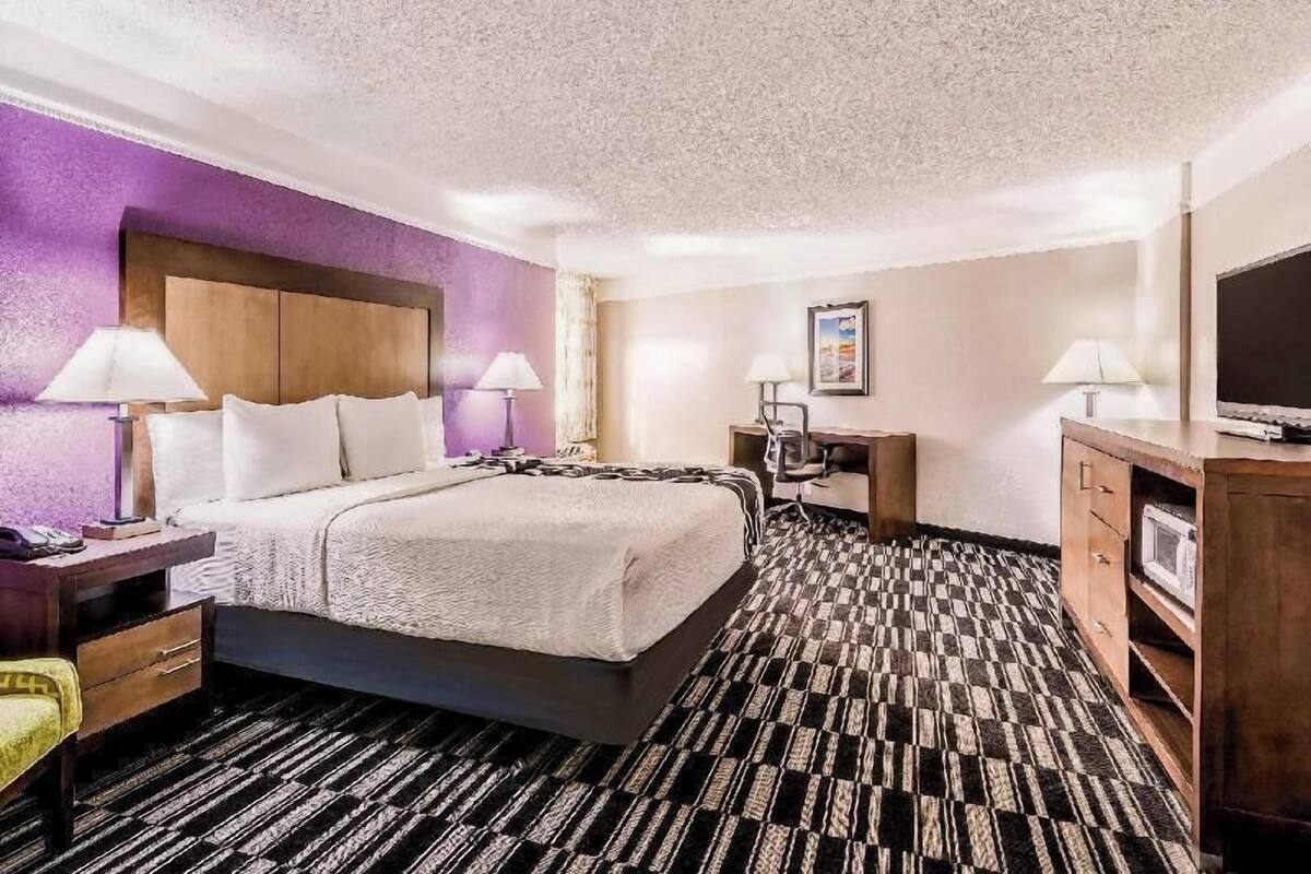 Premium bedding, pillow-top beds, blackout curtains, iron/ironing board