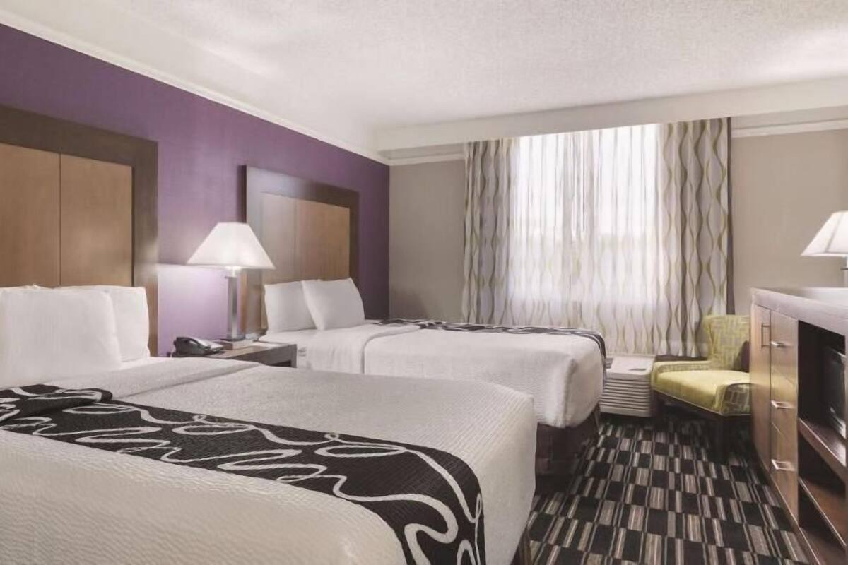 Premium bedding, pillow-top beds, blackout curtains, iron/ironing board