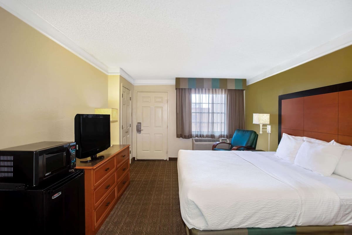 Premium bedding, desk, laptop workspace, iron/ironing board