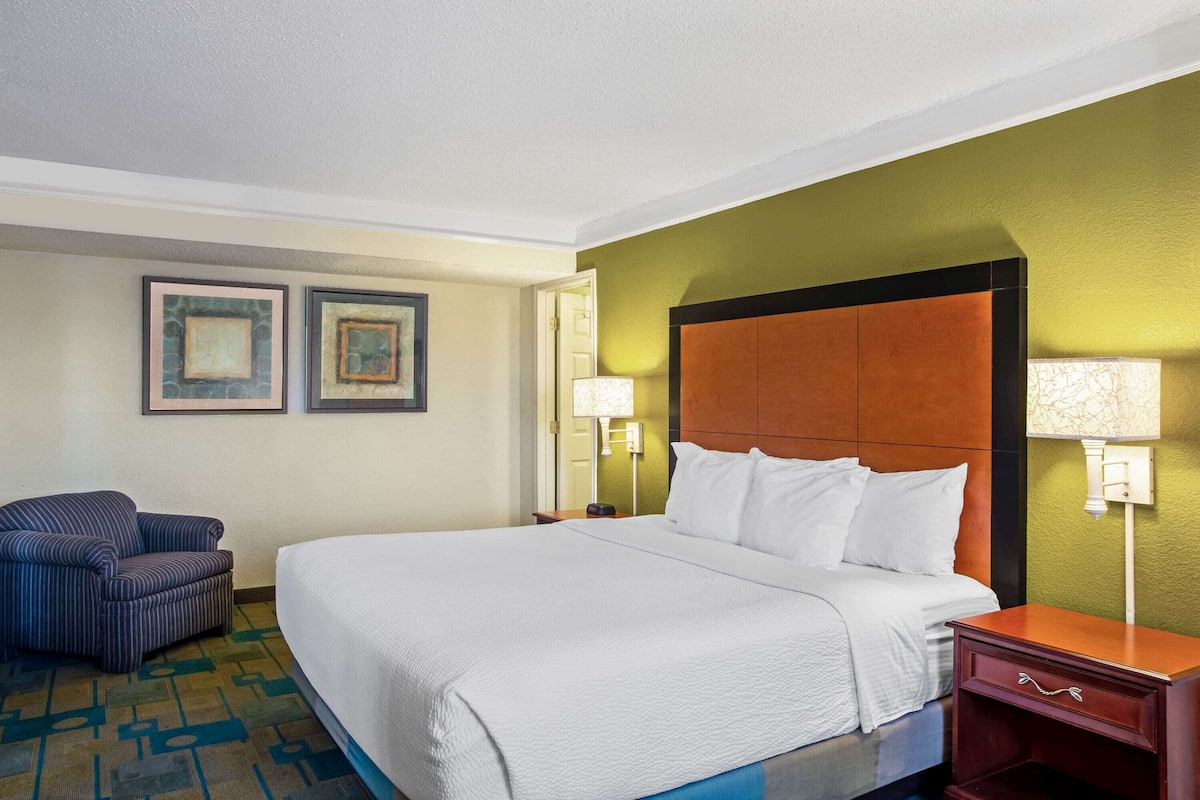 Premium bedding, desk, laptop workspace, iron/ironing board