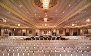 Formal gatherings take place in this elegantly designed conference room, featuring a symmetrical layout and sophisticated ambiance.