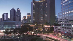 A high-rise hotel with a modern design, multiple floors, and a prominent signage. - Makati Shangri-La, Manila (Makati)