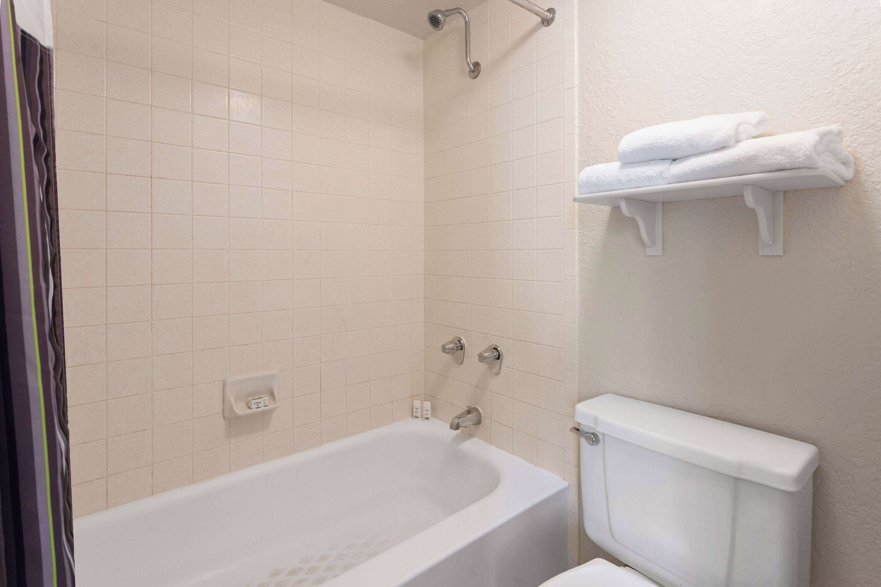 deluxe room, 2 double beds, non smoking | bathroom | combined shower/bathtub, eco-friendly toiletries, hair dryer, towels