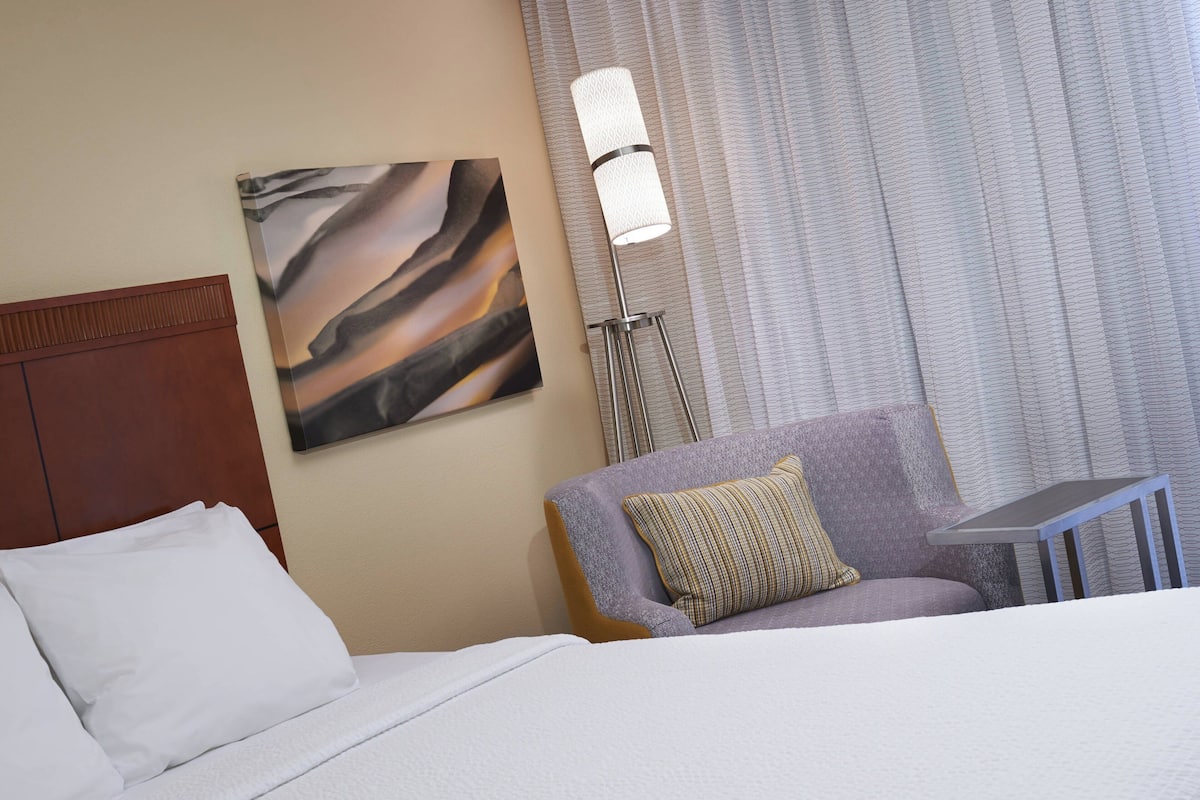 Premium bedding, desk, laptop workspace, iron/ironing board