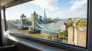 A view of the Tower Bridge and the Shard from a window.