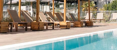 Seasonal outdoor pool, open 9:00 AM to 7:00 PM, sun loungers