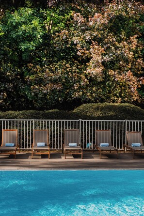 Seasonal outdoor pool, open 9:00 AM to 7:00 PM, sun loungers