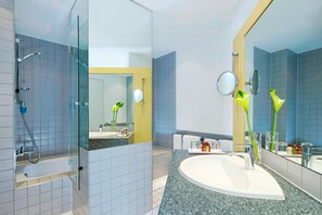 Deluxe Suite, 1 King Bed | Bathroom | Shower, free toiletries, hair dryer, bathrobes