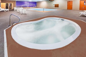 Indoor pool, open 10:00 AM to 10:00 PM, pool loungers