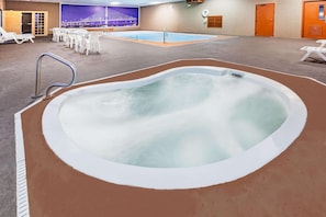 Indoor pool, open 10:00 AM to 10:00 PM, pool loungers