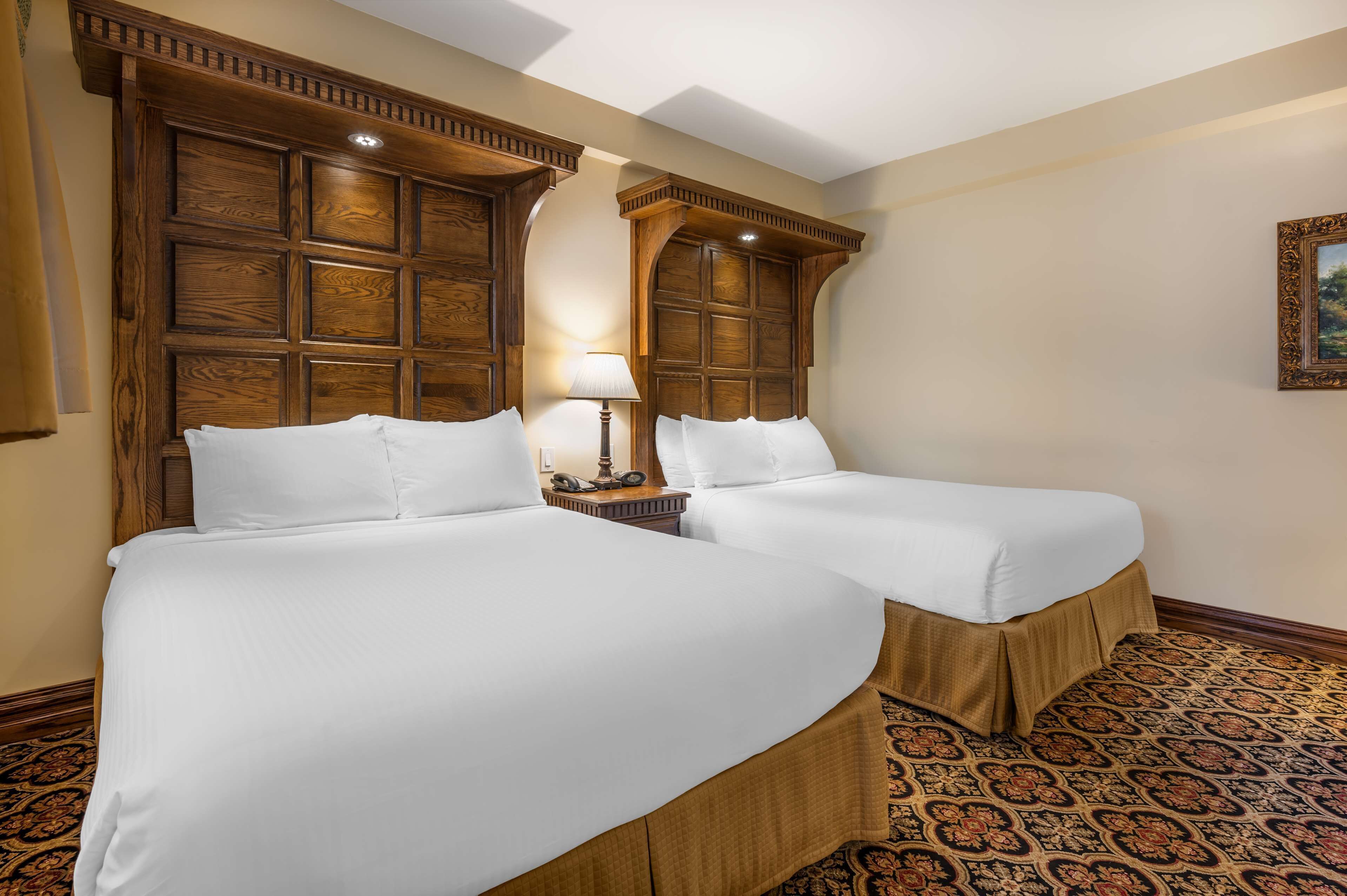 standard room, 2 queen beds, non smoking, fireplace | premium bedding, in-room safe, desk, laptop workspace