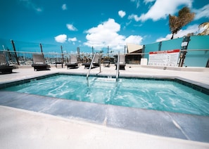 Outdoor pool, open 7:00 AM to 10:00 PM, pool umbrellas, pool loungers