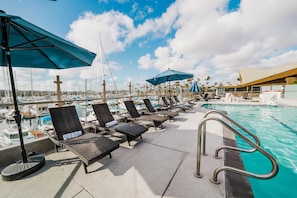 Outdoor pool, open 7:00 AM to 10:00 PM, pool umbrellas, pool loungers