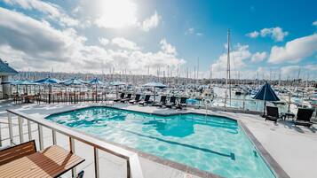 Outdoor pool, open 7:00 AM to 10:00 PM, pool umbrellas, sun loungers