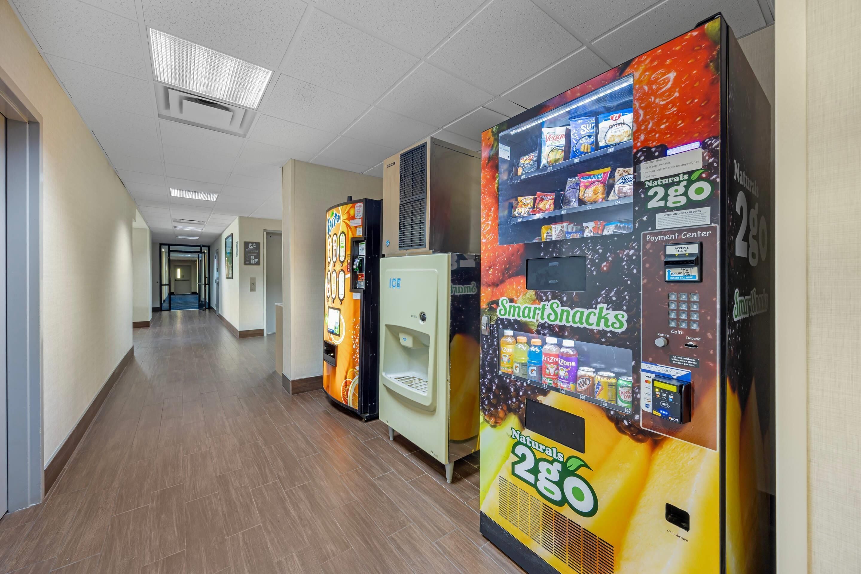 A hallway with vending machines and a water cooler.