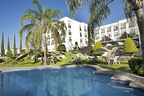 Outdoor pool, open 8:00 AM to 8:00 PM, free cabanas, pool umbrellas