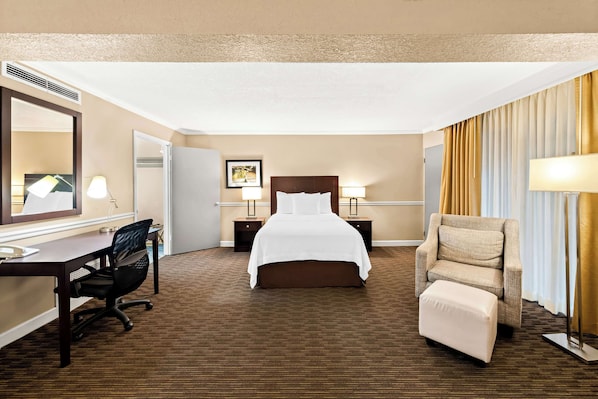 Family Suite, 1 King Bed, Refrigerator & Microwave, Pool View | Desk, laptop workspace, iron/ironing board, cots/infant beds