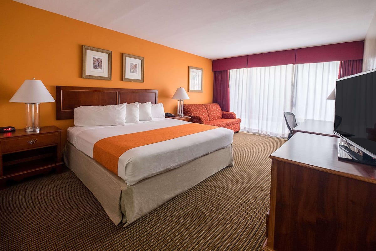Premium bedding, desk, laptop workspace, blackout curtains
