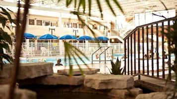 Indoor pool, a waterfall pool, pool umbrellas