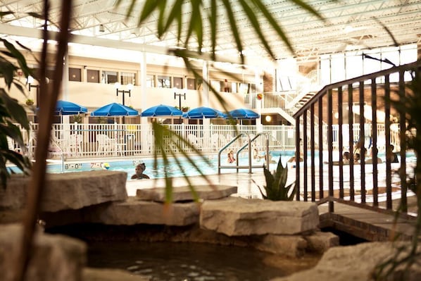 Indoor pool, a waterfall pool, pool umbrellas