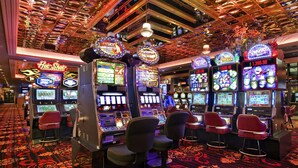 A casino with slot machines and bar stools. - Maverick Hotel and Casino by Red Lion Hotels (Elko)