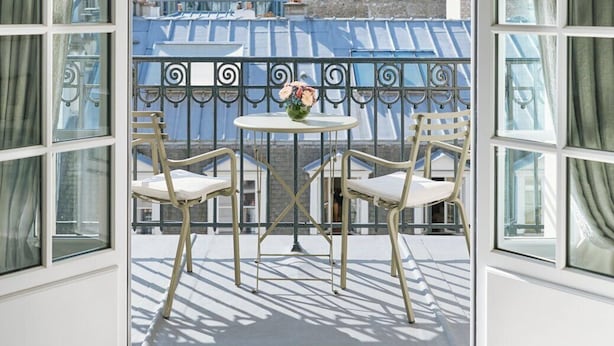 An open balcony with a view of buildings and a blue-roofed structure. - Le Bristol Paris - Oetker Hotels (Paris)