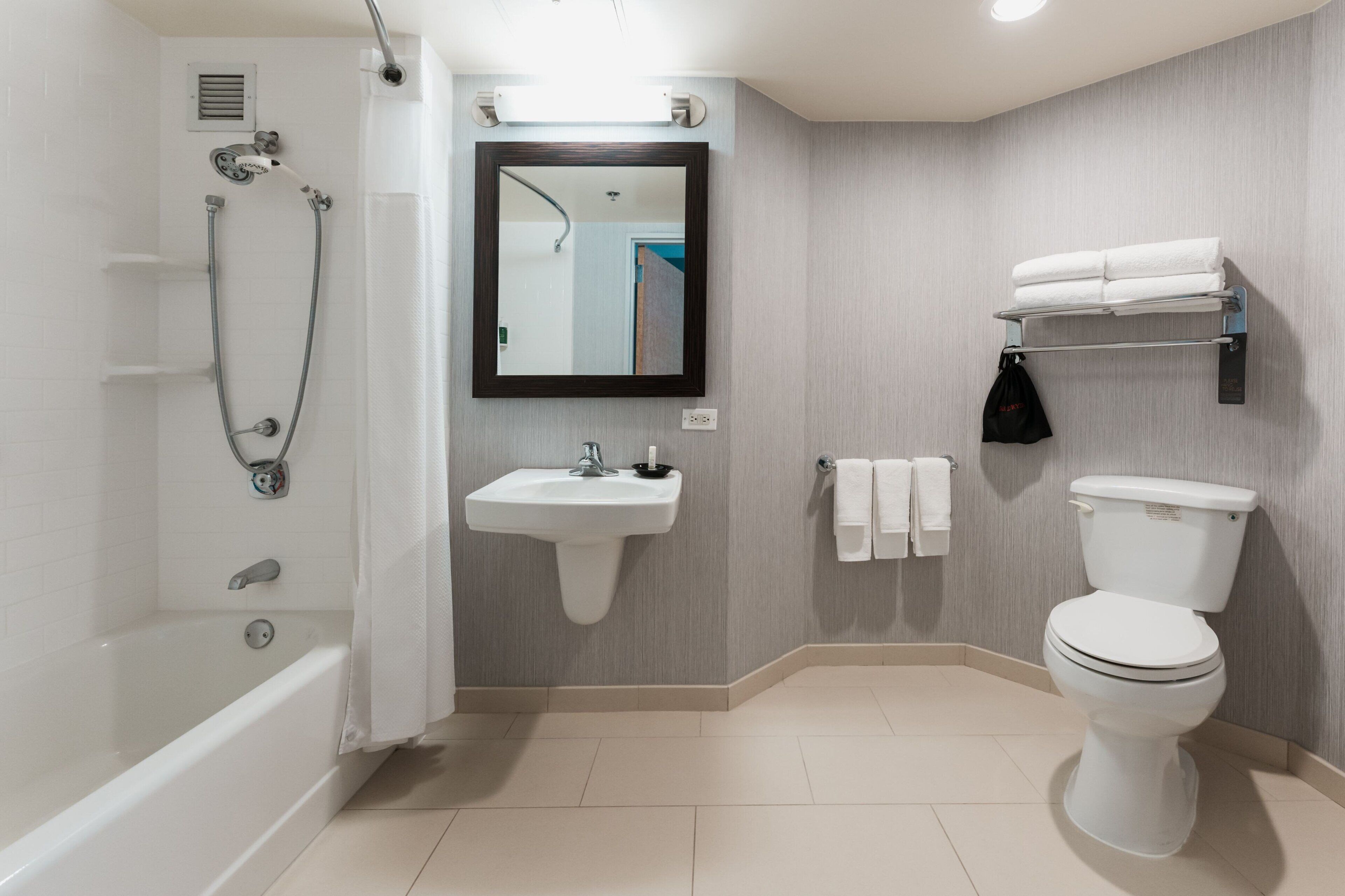 combined shower/bathtub, eco-friendly toiletries, hair dryer, towels