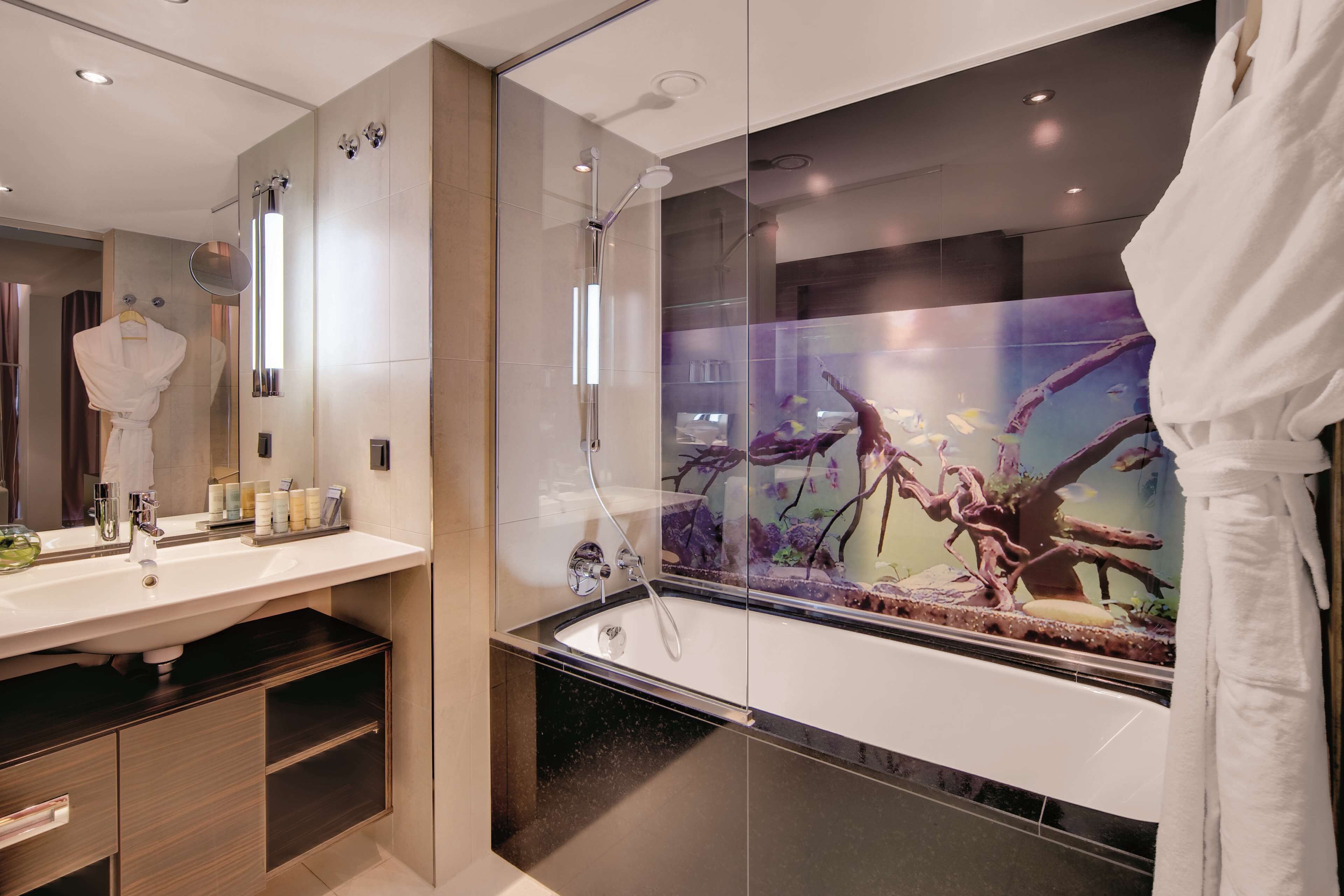 junior suite | bathroom | rainfall showerhead, eco-friendly toiletries, hair dryer, towels